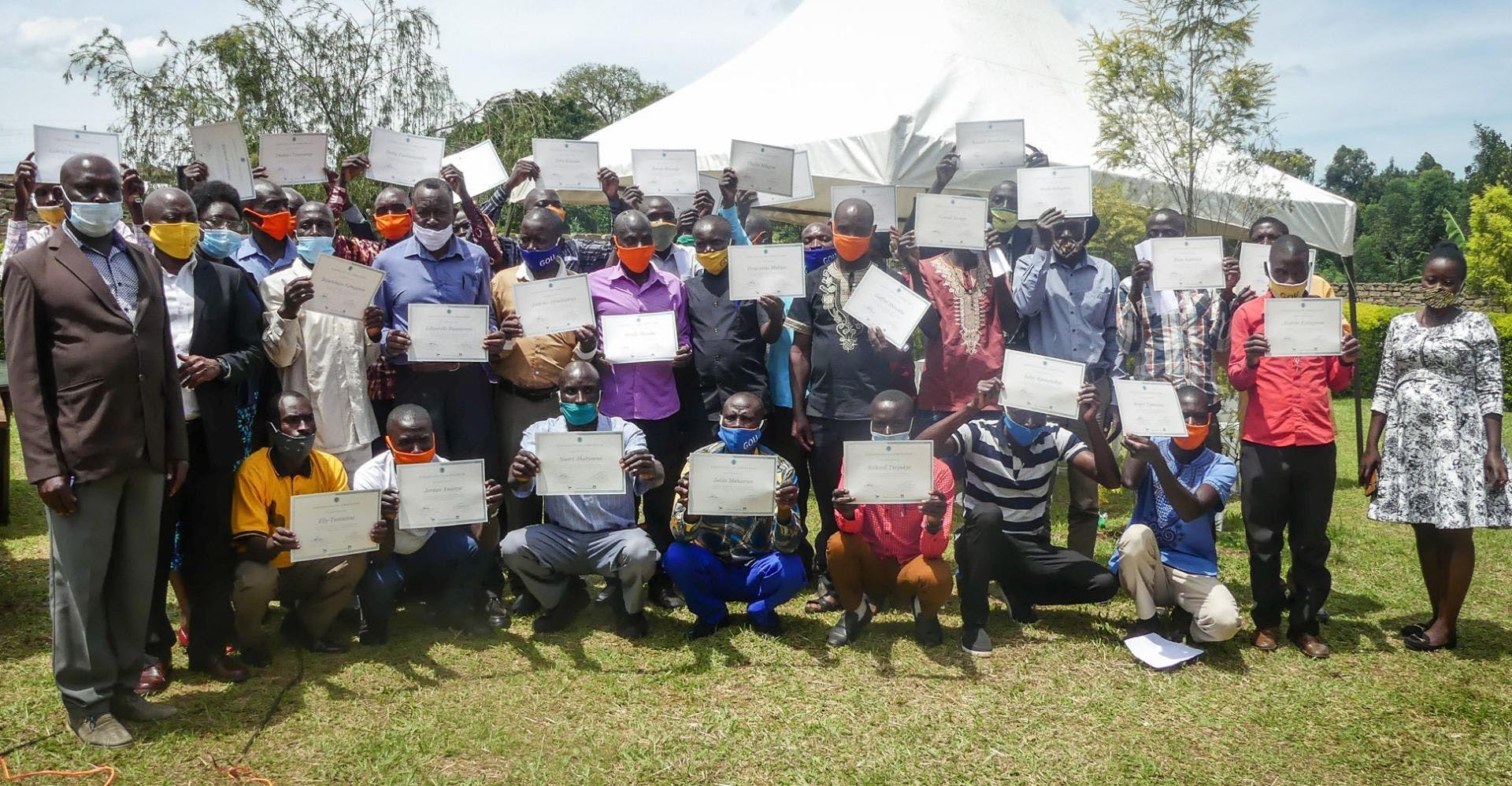 Farmers receiving their certificates after completing the 2-year agronomy training – Nov 2020