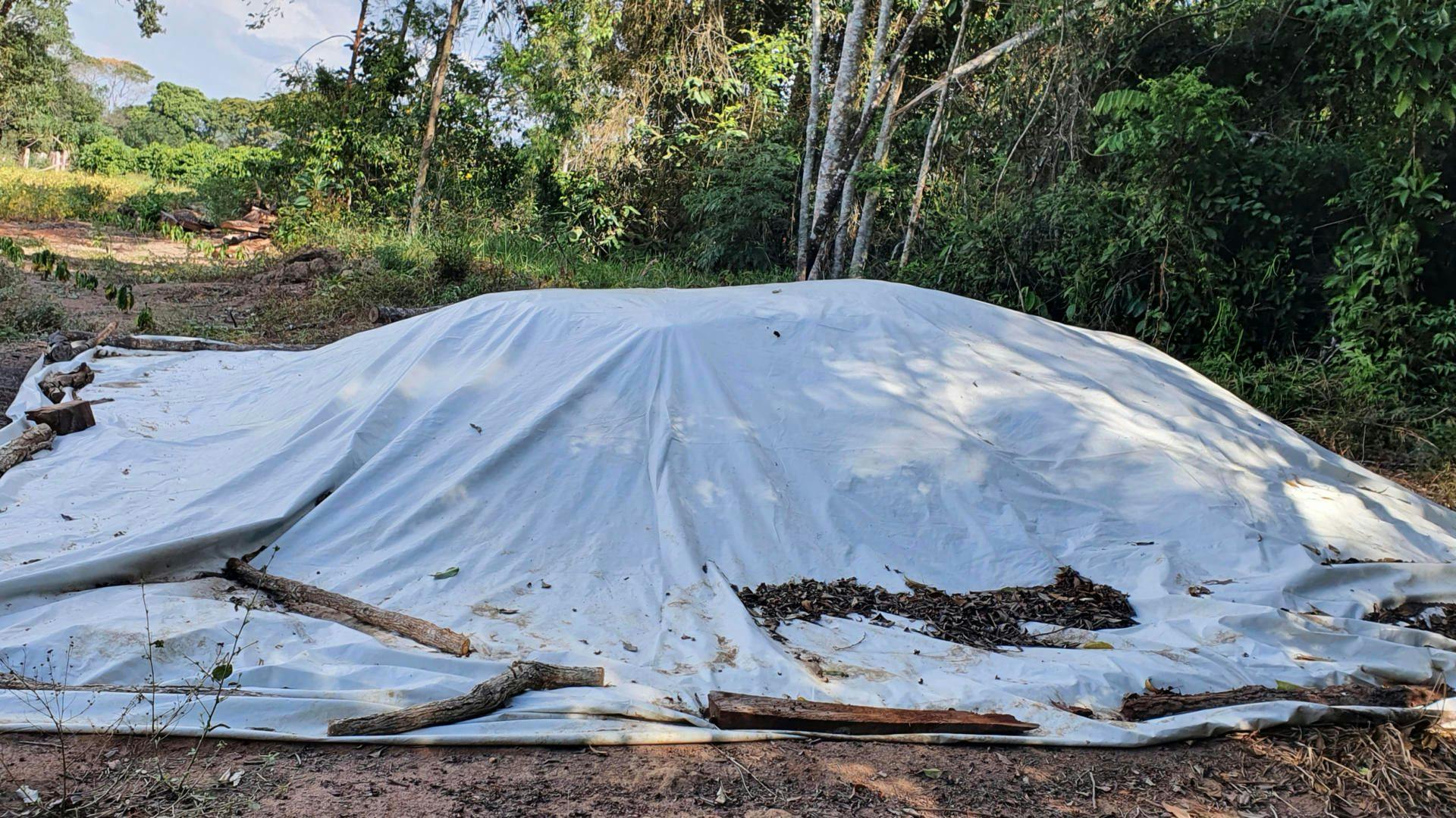 Bokashi being prepared under a tarp