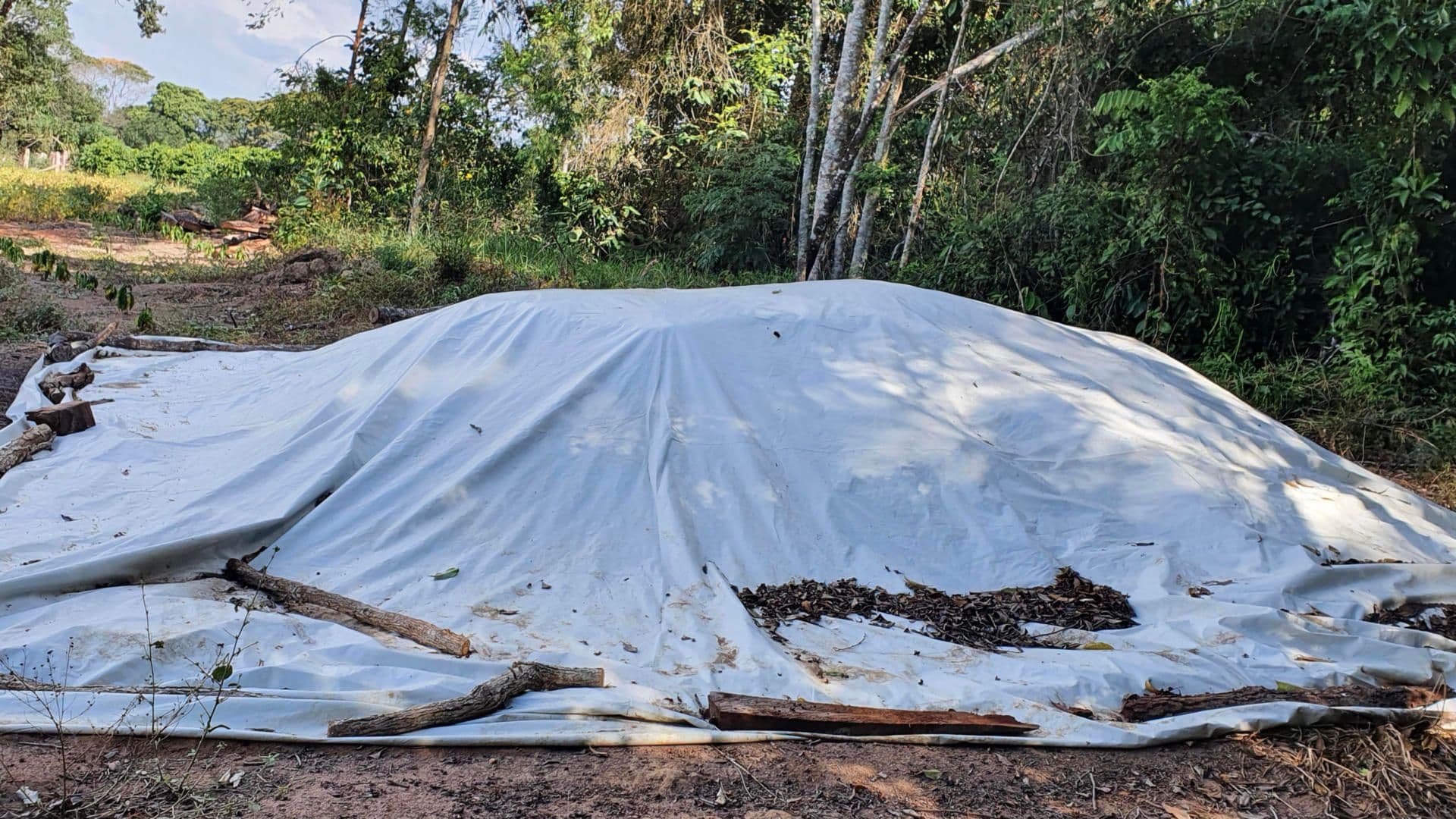 Bokashi being prepared under a tarp Bokashi being prepared under a tarp