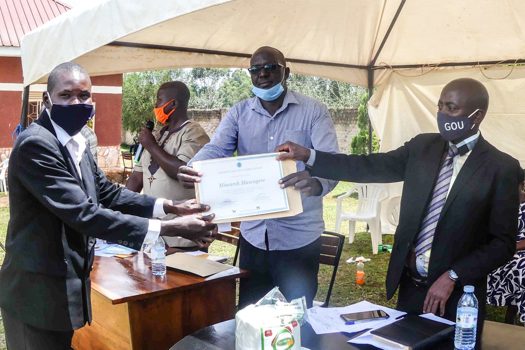 Misearch receiving his certificate at the UCAT Kakumiro close-out ceremony Misearch receiving his certificate at the UCAT Kakumiro close-out ceremony